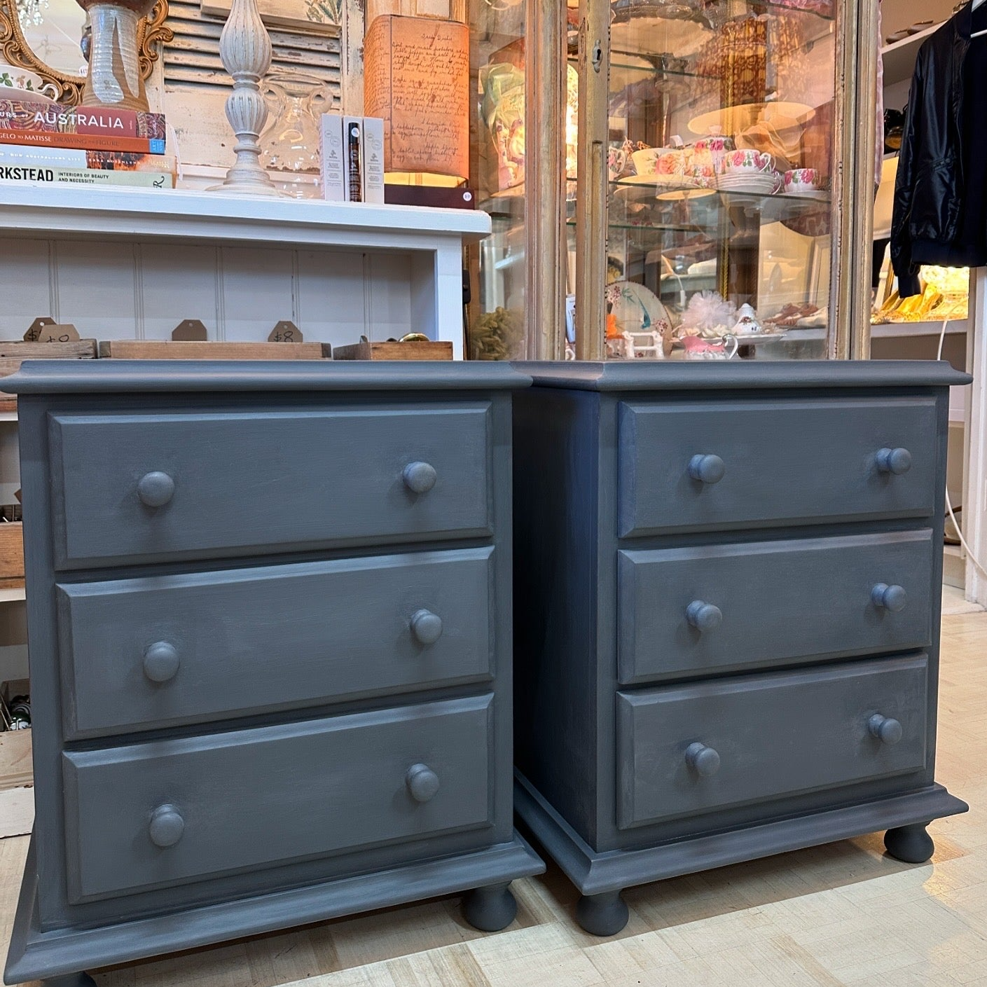 One pair of wooden bedside tables with drawers